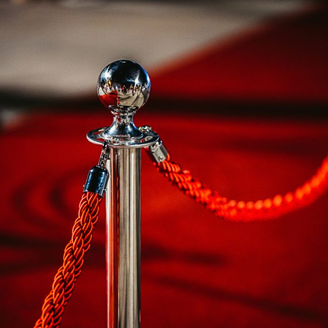 Stanchions and ropes set up for crowd management at an event